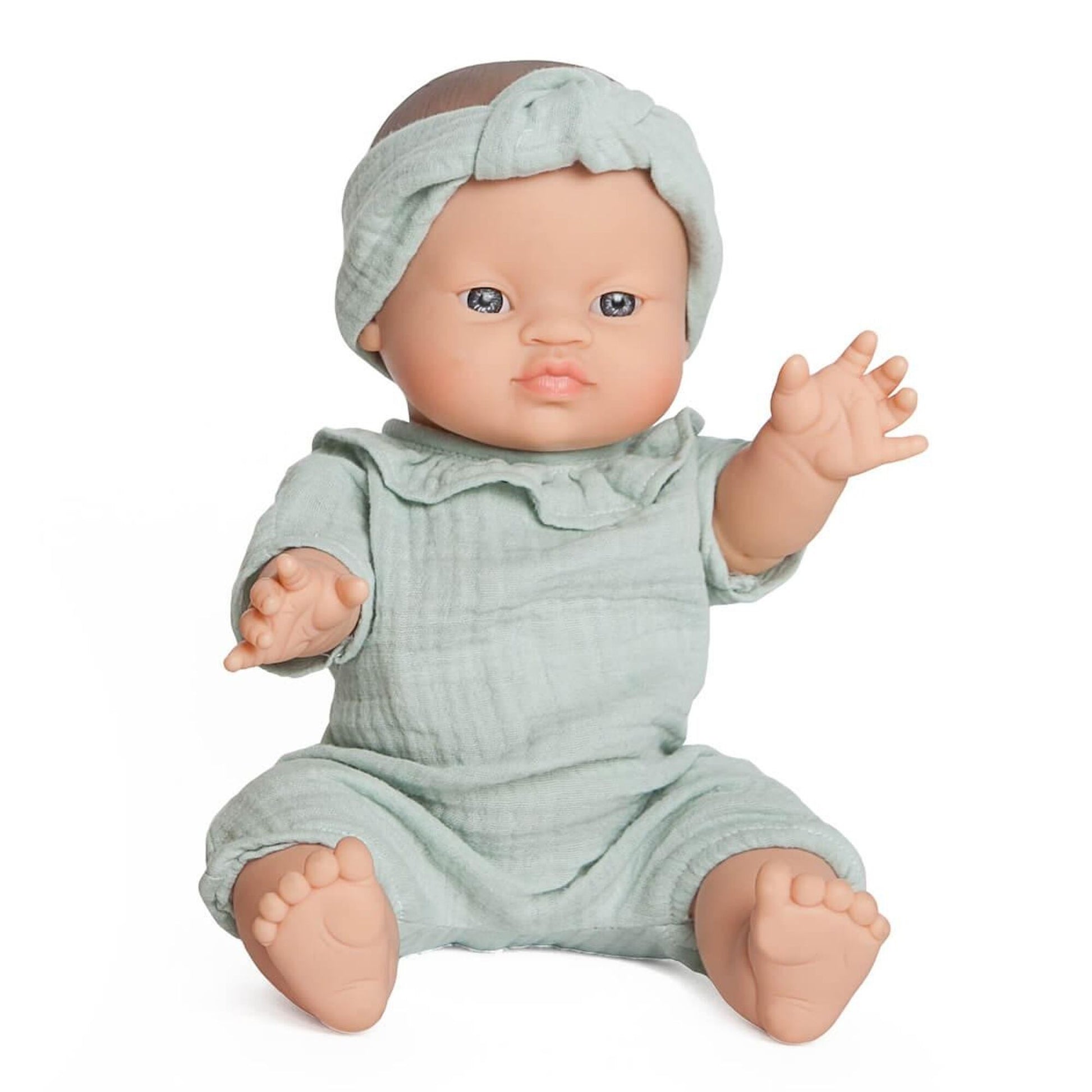 Green doll sitting