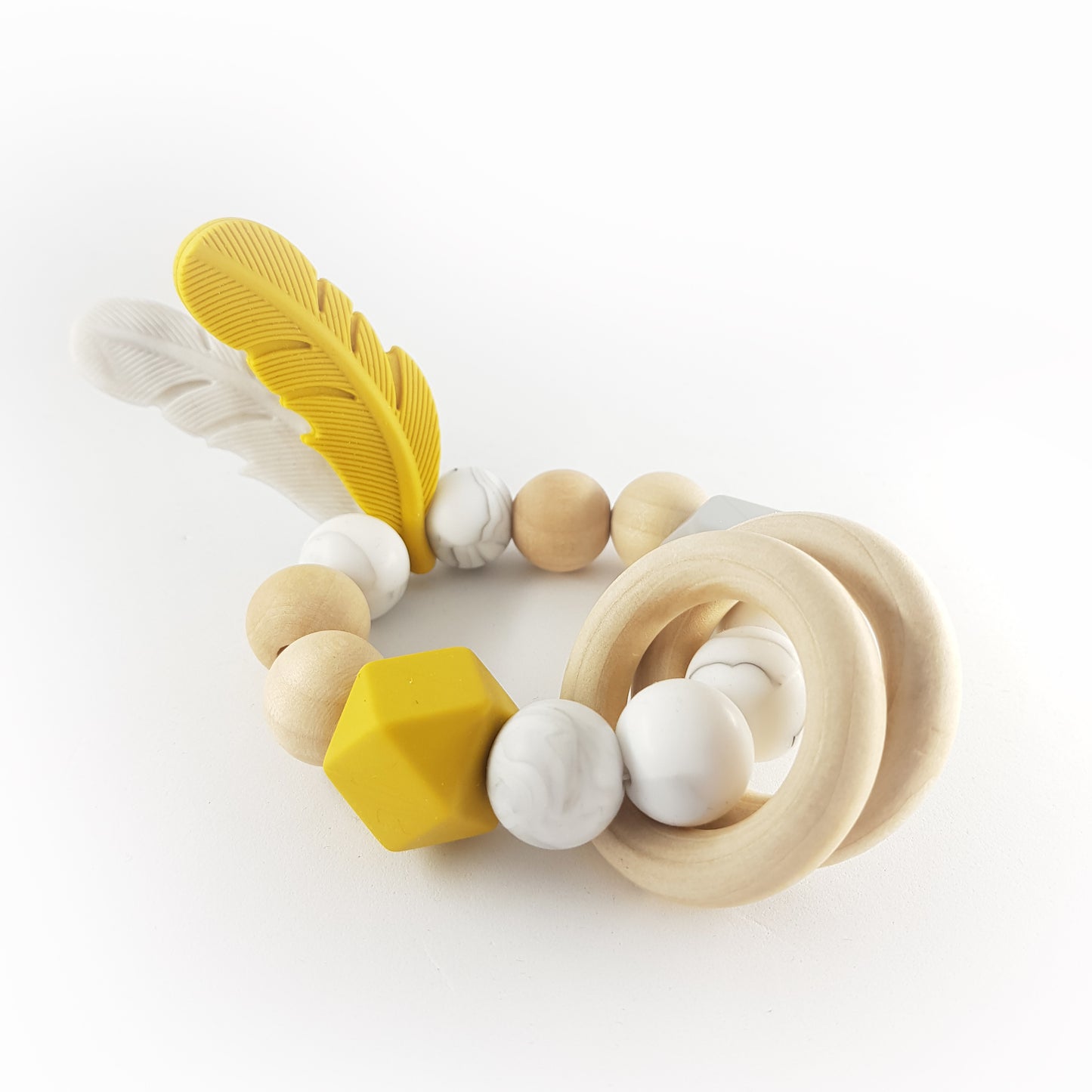 FEATHER teether, mustard