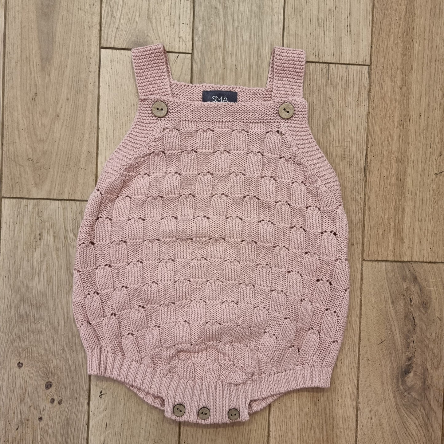 CHERRY knitted baby romper in cotton