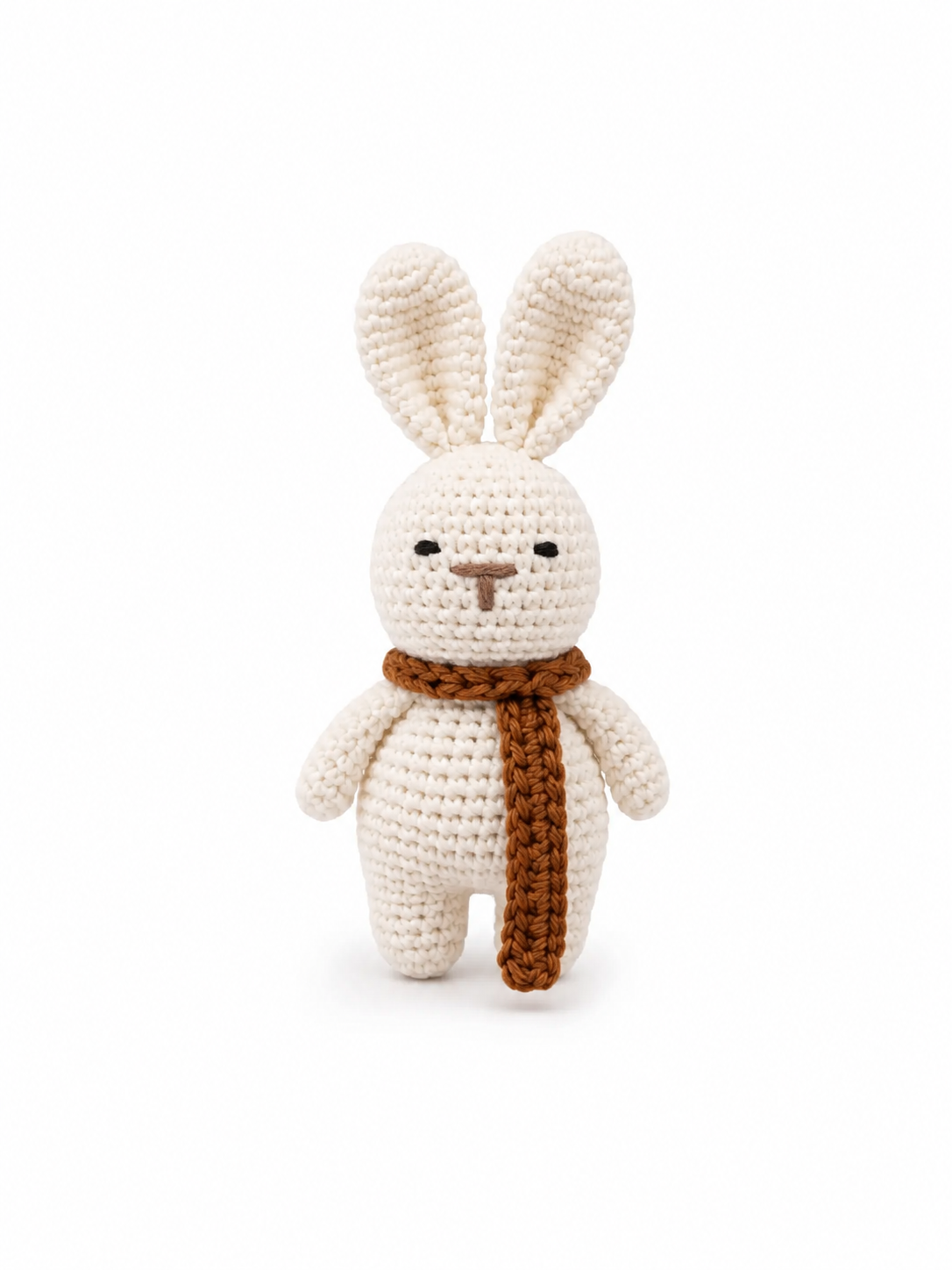 Close-up product view of a handmade ivory crochet bunny with a brown scarf