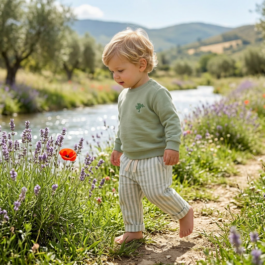 Child walking through a field of lavender and wildflowers with a scenic background