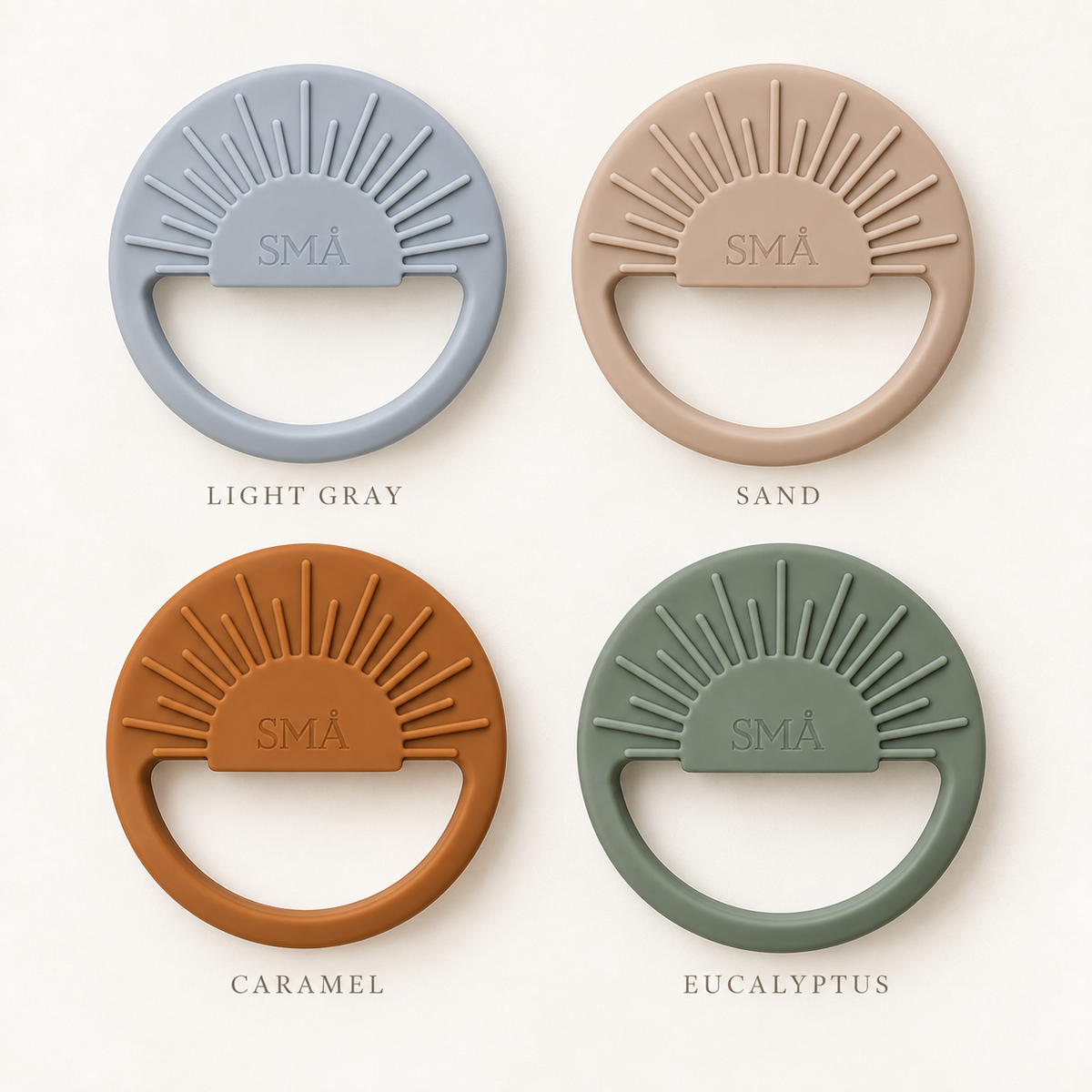 SMÅ Sun Baby Teethers in light gray, sand, caramel and eucalyptus arranged on a cream background
