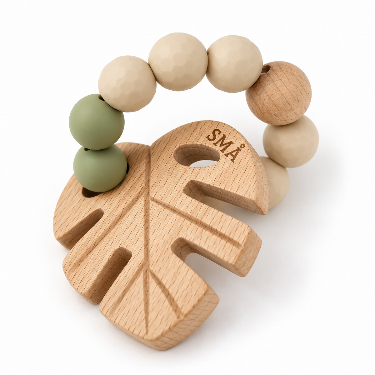 SMÅ Leaf Baby Teether with natural beech wood leaf and sage green food-grade silicone beads on a white background