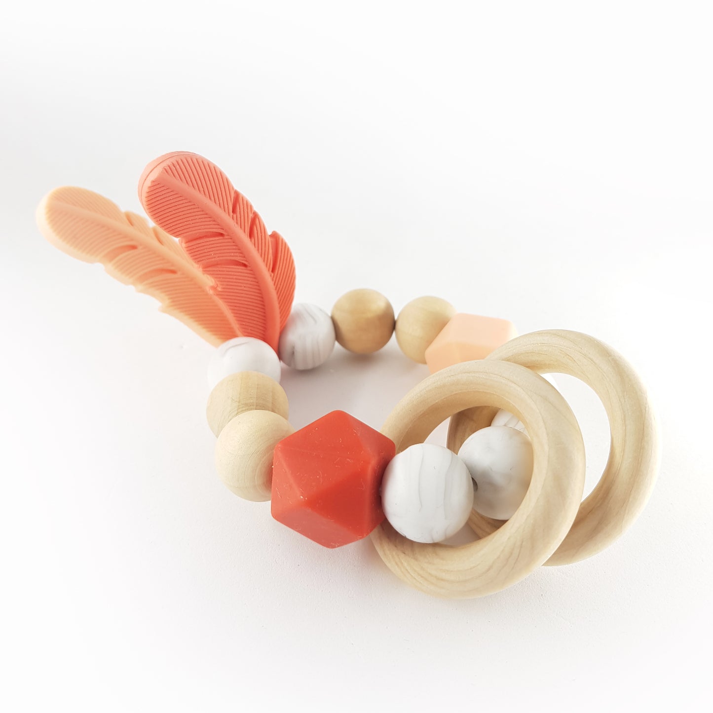 FEATHER teether, coral